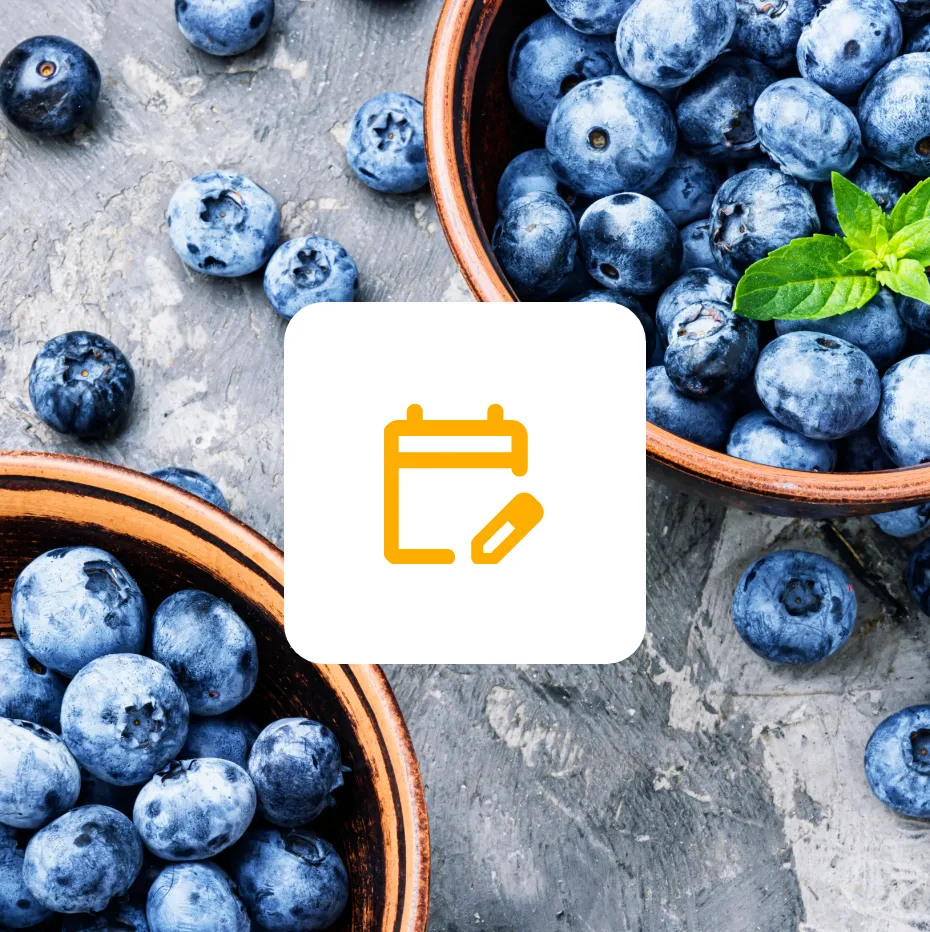 A bowl of blueberries with a calendar icon on top.