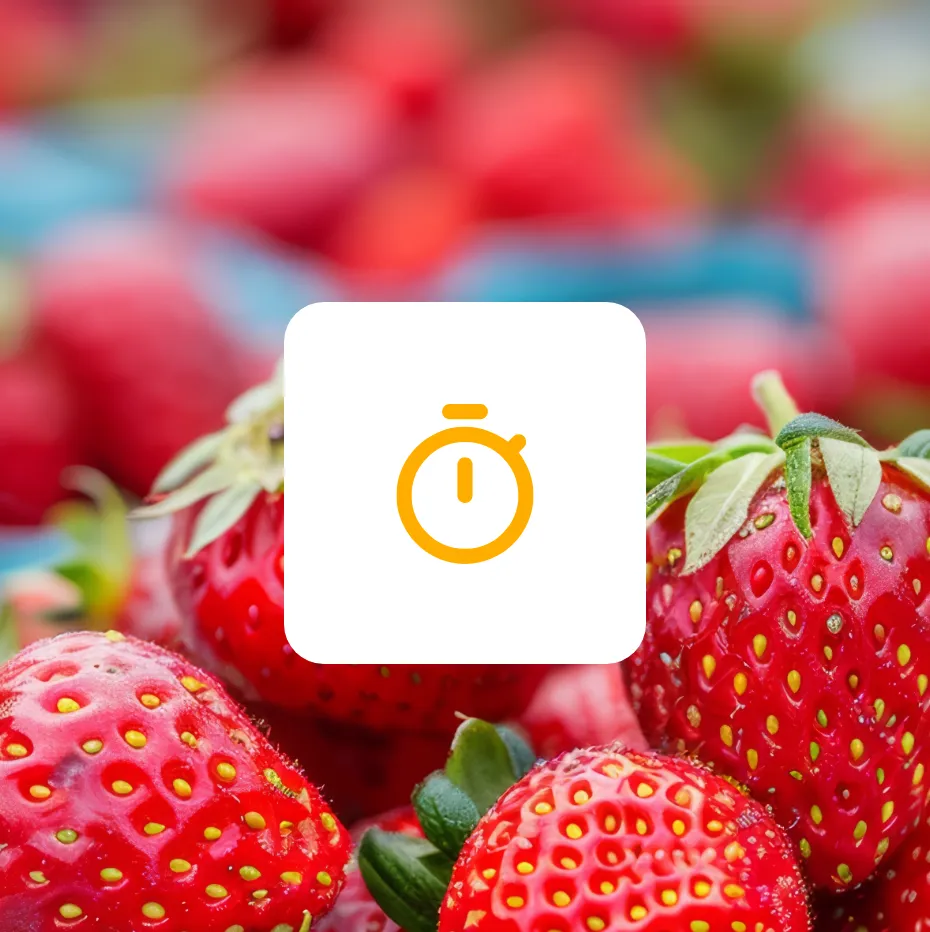 A close up of a bunch of red strawberries with a timer icon on it.